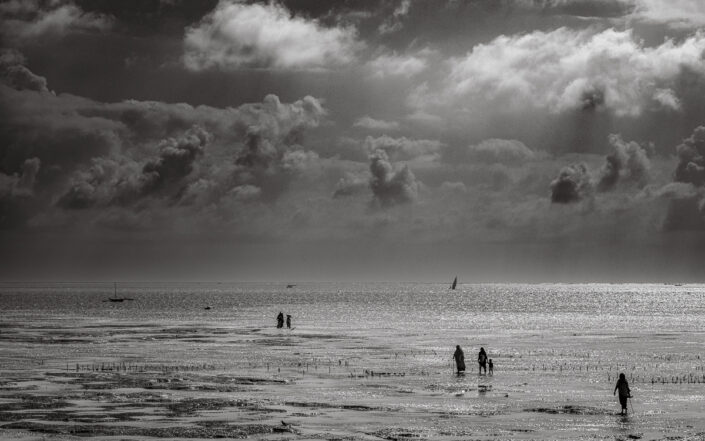 Seaweed farmers head to work, Jambiani, Zanzibar, Tanzania.