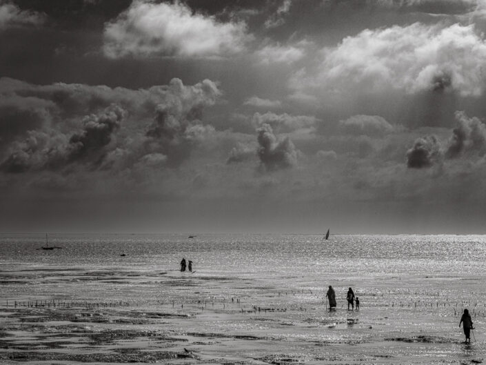 Seaweed farmers head to work, Jambiani, Zanzibar, Tanzania.