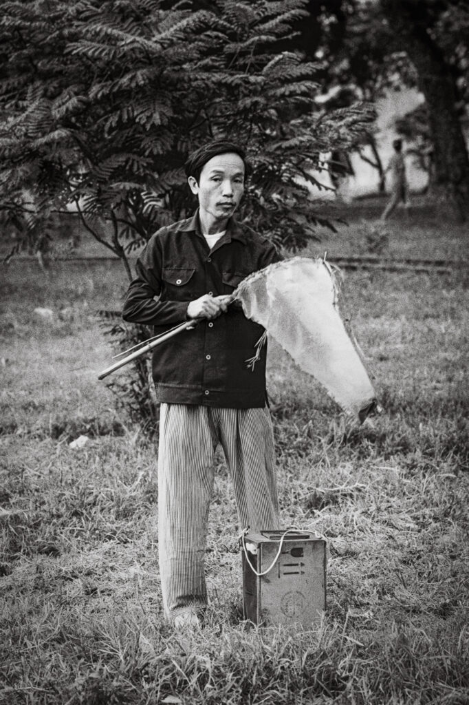 Catching grasshoppers, Hanoi. Oct 1992